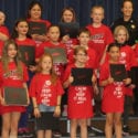 5th grade students holding certificates