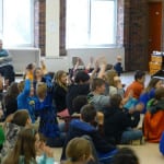 Students clapping during performance