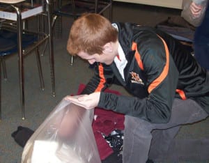 Members of the Service Club bagging coats