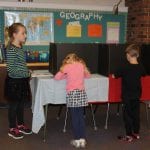 kindergarten students casting their vote