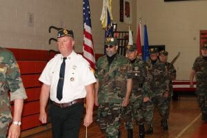 Service men walking into assembly