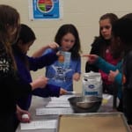 WBH students mix ingredients for cookies