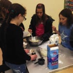 WBH students mix ingredients for cookies