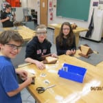 Students work on constructing clocks